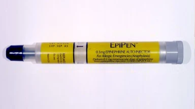 auto-injector pen applied to the thigh